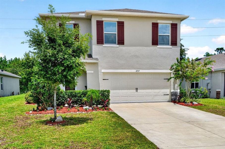 Front exterior of a new home in , Ormond Beach, FL, highlighting curb appeal (Image 24). Front exterior of a new home in , Ormond Beach, FL, highlighting curb appeal (Image 24).