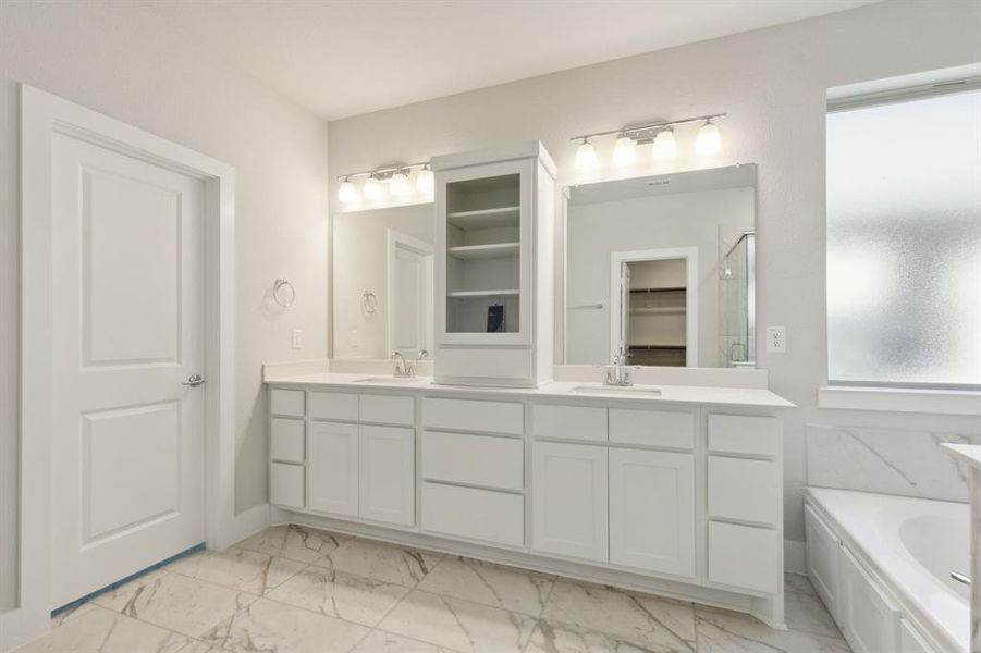 Bathroom featuring hardwood / wood-style floors, vanity, and independent shower and bath