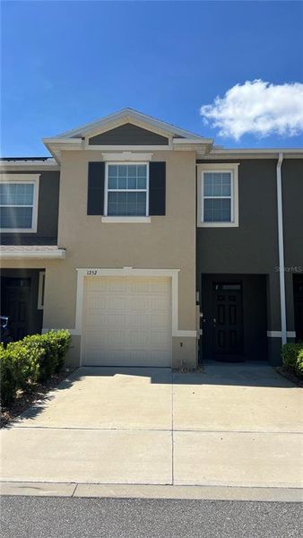 Front exterior of a new home in Atria at Ridgewood Lakes, Davenport, FL, highlighting curb appeal (Image 2).