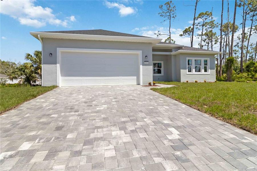 Front exterior of a new home in , North Port, FL, highlighting curb appeal (Image 16).