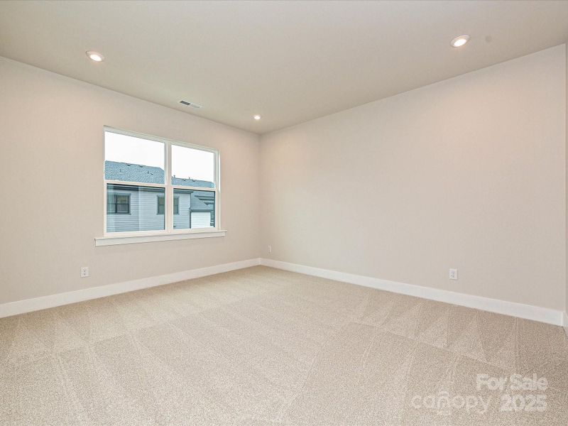 Glimpse into the secondary bedrooms and see the Life-changing Tri Pointe Homes design.