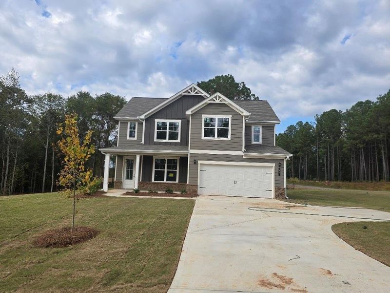 Front exterior of a new home in Waters Edge, Mansfield, GA, highlighting curb appeal (Image 2).