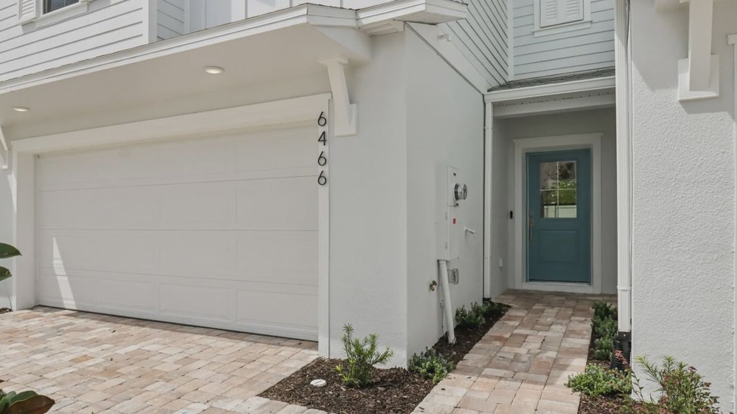 Exterior details and patio area of a home in Cyrene at Harmony, St. Cloud (Image 3).