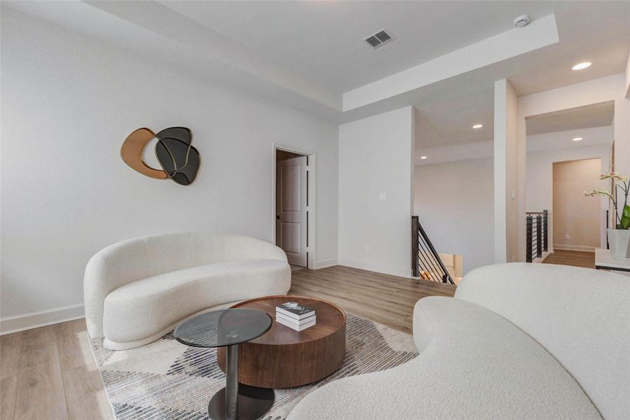 This modern living room features sleek, curved sofas and a contemporary coffee table on a stylish rug. The open layout is enhanced by light wood flooring, minimalistic wall decor, and ample natural light, creating a welcoming and elegant space. This modern living room features sleek, curved sofas and a contemporary coffee table on a stylish rug. The open layout is enhanced by light wood flooring, minimalistic wall decor, and ample natural light, creating a welcoming and elegant space.