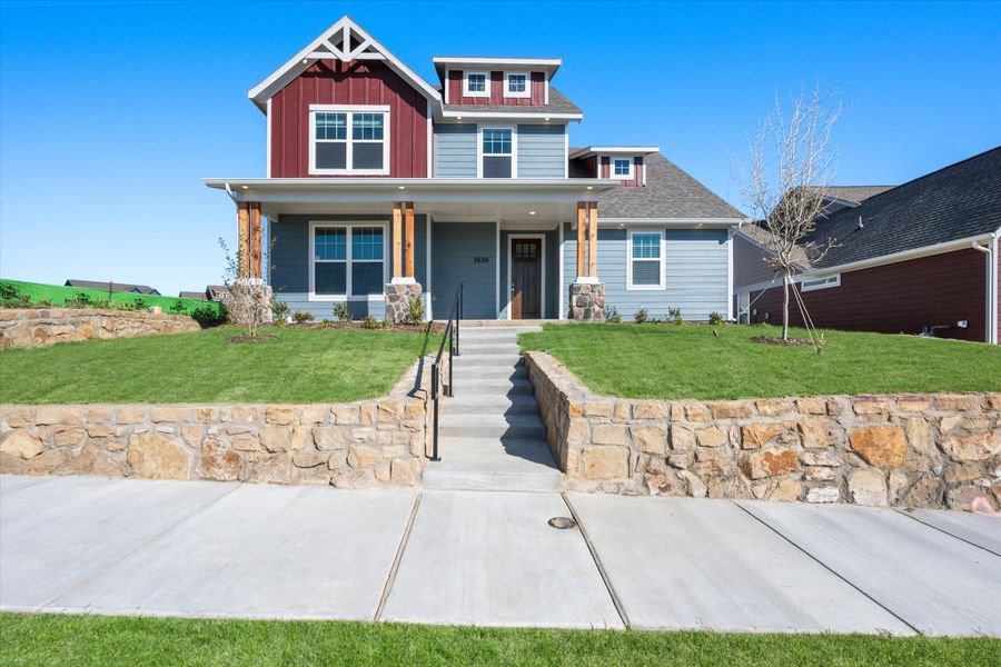 Front exterior of a new home in Heritage Towne, Midlothian, TX, highlighting curb appeal (Image 27).