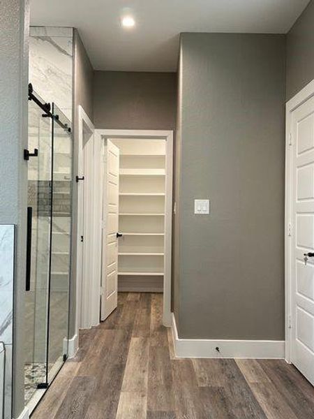 Master Bathroom featuring hardwood / wood-style floors and an enclosed shower