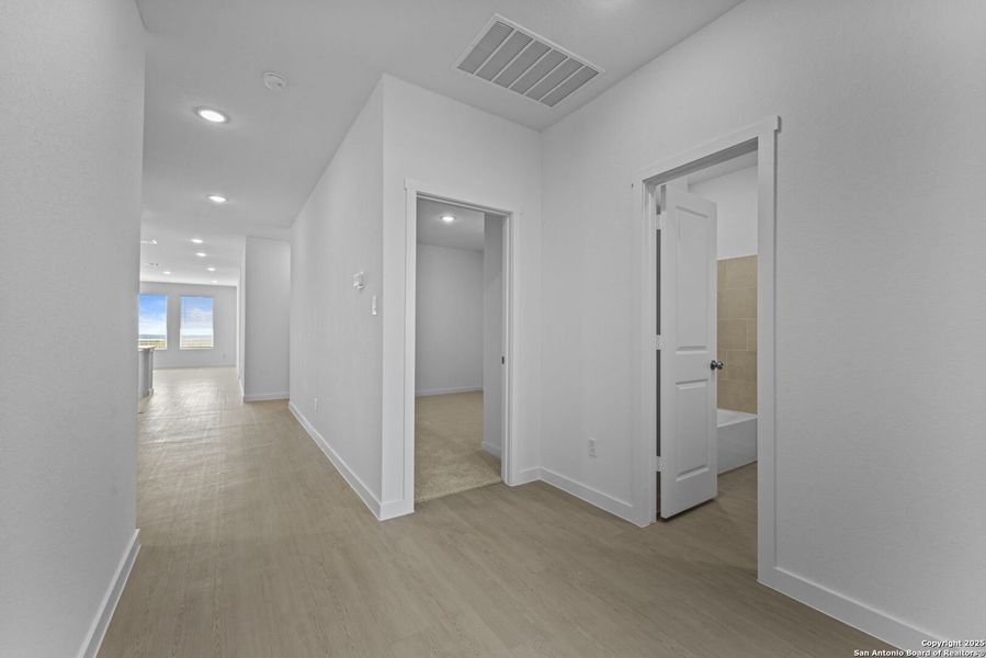 Spacious, unfurnished interior of a new home in Waterwheel: Coastline Collection, San Antonio (Image 20).