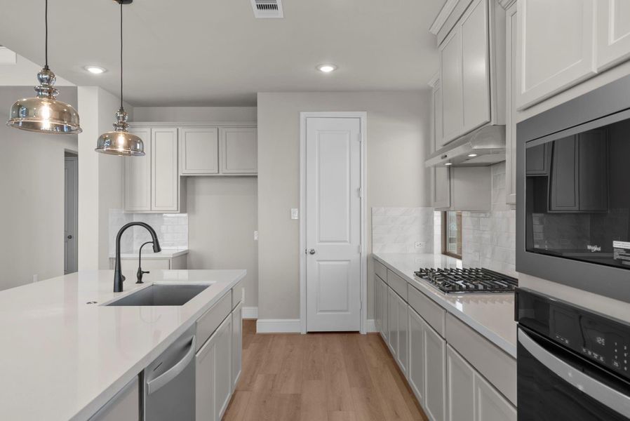 Furnished interior view inside a new home in Coastal Point, League City (Image 7).