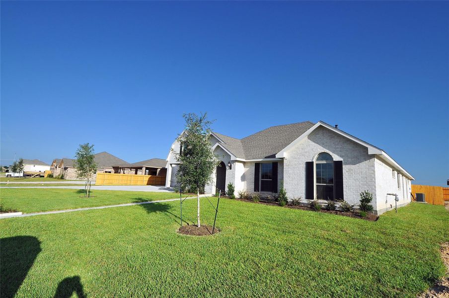 Front exterior of a new home in , League City, TX, highlighting curb appeal (Image 22).