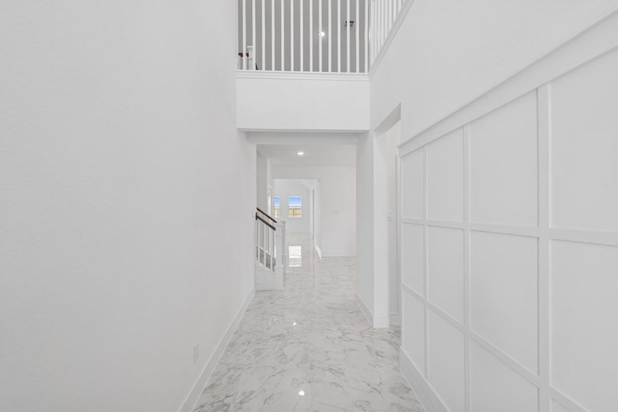Inviting foyer with decorative feature wall
