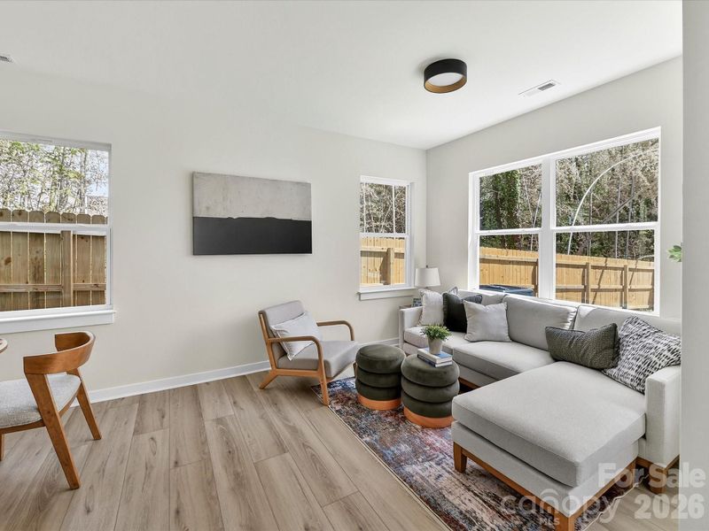 Bright and inviting living room filled with natural light, featuring an open layout and clean, modern finishes perfect for everyday living.