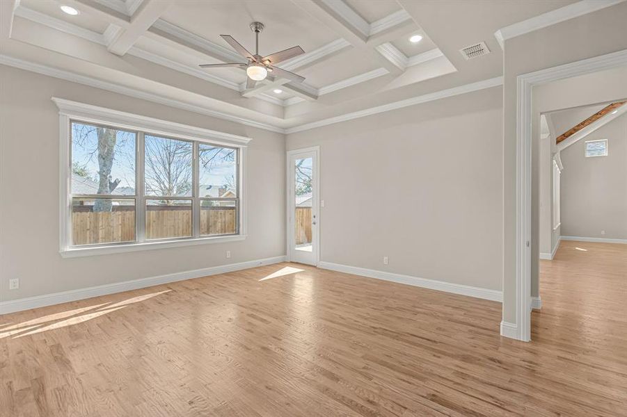 Unfurnished room featuring crown molding, coffered ceiling, and beamed ceiling