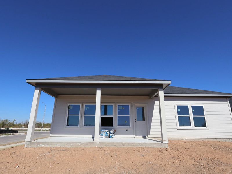 Exterior details and patio area of a home in Carillon, Manor (Image 7).