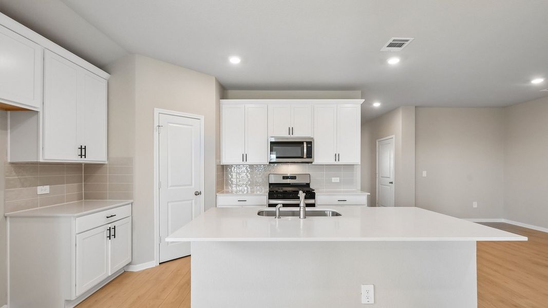 Furnished interior view inside a new home in Carillon, Manor (Image 9).