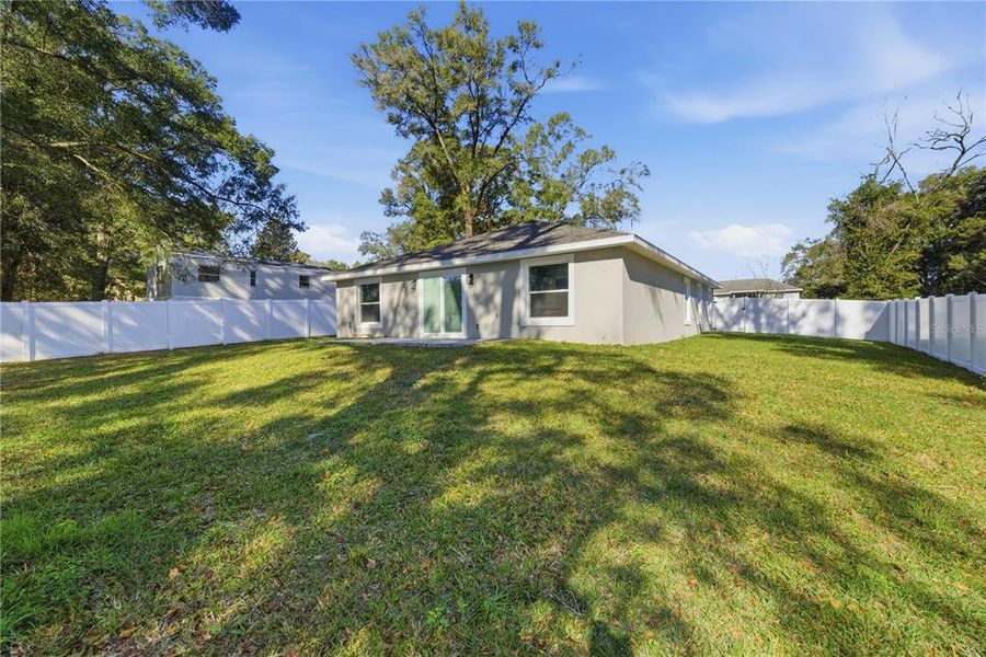 Exterior details and patio area of a home in , Summerfield (Image 20).