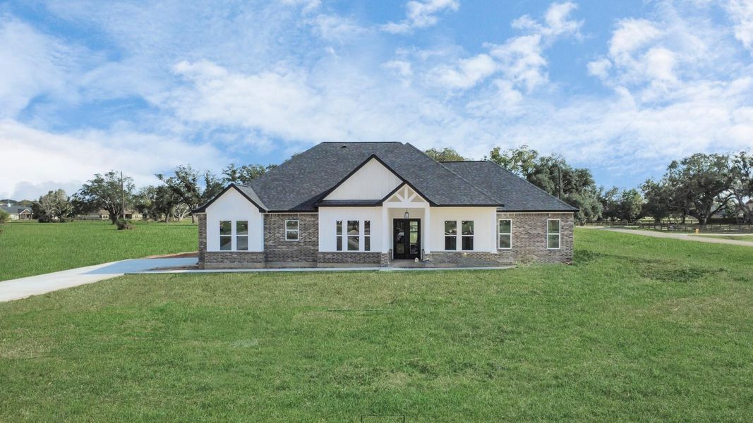 Front exterior of a new home in , Rosharon, TX, highlighting curb appeal (Image 6). Front exterior of a new home in , Rosharon, TX, highlighting curb appeal (Image 6).