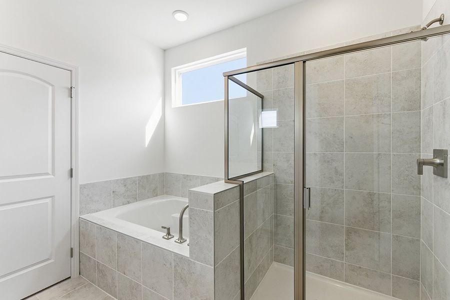 A bathroom with a glass shower.
