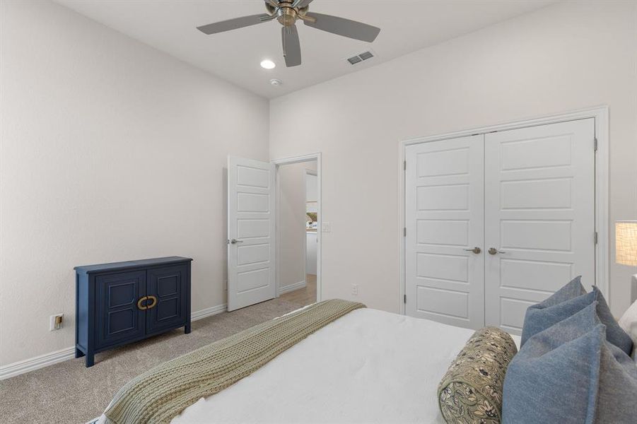 Bedroom featuring carpet, a closet, ceiling fan, and recessed lighting Bedroom featuring carpet, a closet, ceiling fan, and recessed lighting