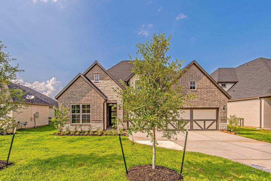 Front exterior of a new home in WaterStone, Montgomery, TX, highlighting curb appeal (Image 1). Front exterior of a new home in WaterStone, Montgomery, TX, highlighting curb appeal (Image 1).
