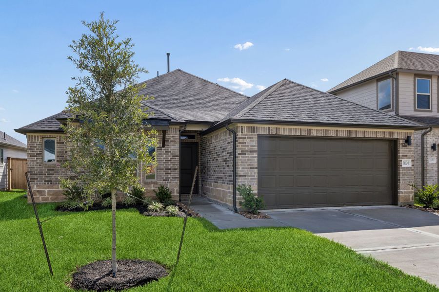 Front exterior of a new home in Riviera Pines, Huffman, TX, highlighting curb appeal (Image 2). Front exterior of a new home in Riviera Pines, Huffman, TX, highlighting curb appeal (Image 2).