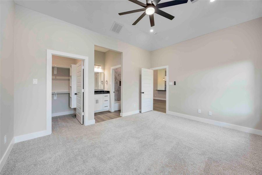 Primary Bedroom highlighted by refined tray ceiling,ceiling fan, walk-in closet,and spa inspired en-suite. Primary Bedroom highlighted by refined tray ceiling,ceiling fan, walk-in closet,and spa inspired en-suite.