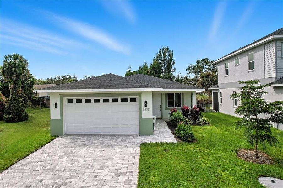 Front exterior of a new home in , Sarasota, FL, highlighting curb appeal (Image 1). Front exterior of a new home in , Sarasota, FL, highlighting curb appeal (Image 1).