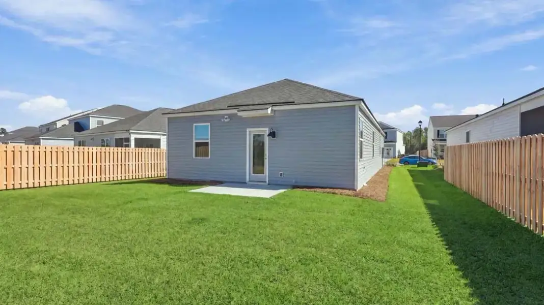 Exterior details and patio area of a home in The Lakes at North Glynn, Brunswick (Image 18).