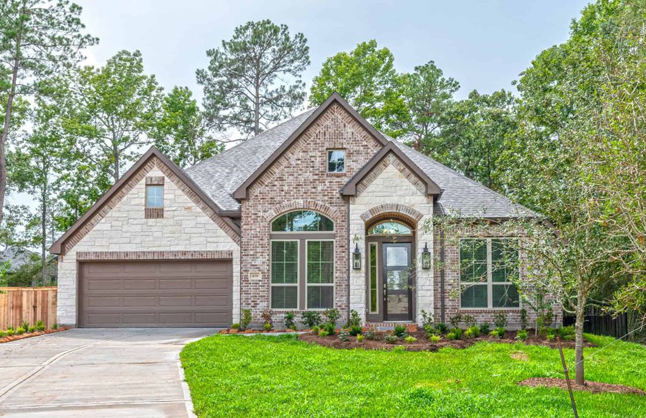 Representative exterior photo of a completed home built from the 3030 by Ravenna Homes in The Woodlands Hills 65′, Willis, TX (Image 2). Representative exterior photo of a completed home built from the 3030 by Ravenna Homes in The Woodlands Hills 65′, Willis, TX (Image 2).