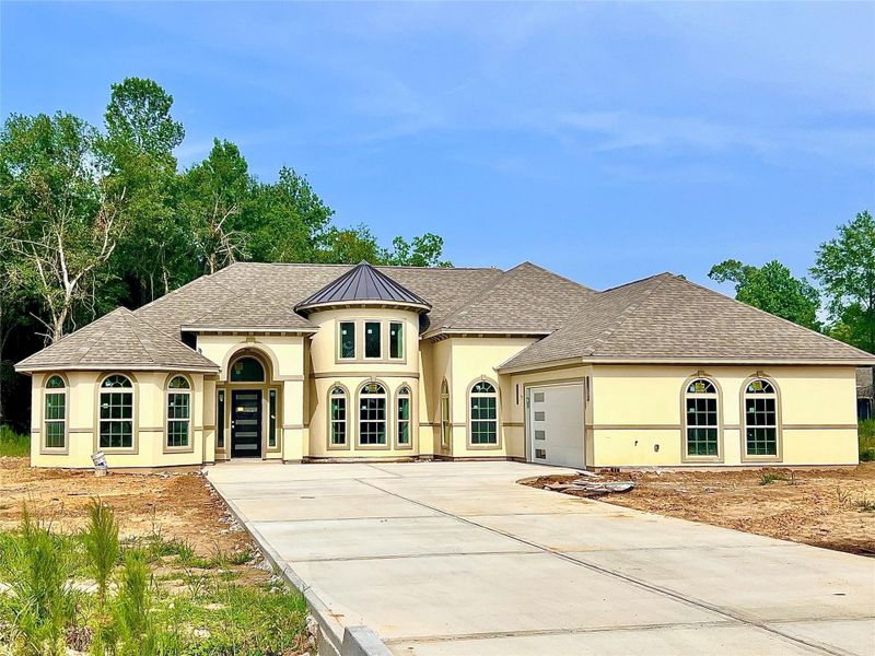 Front exterior of a new home in , Dayton, TX, highlighting curb appeal (Image 24).