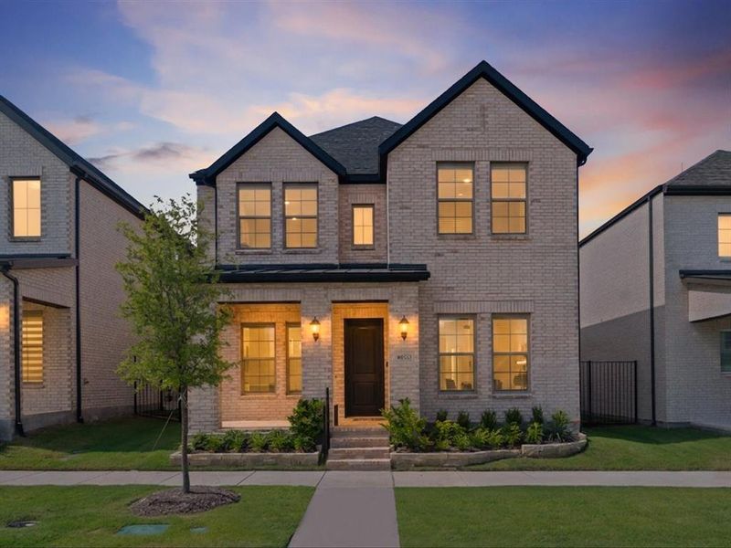 Front exterior of a new home in Village on Main Street, Frisco, TX, highlighting curb appeal (Image 2).