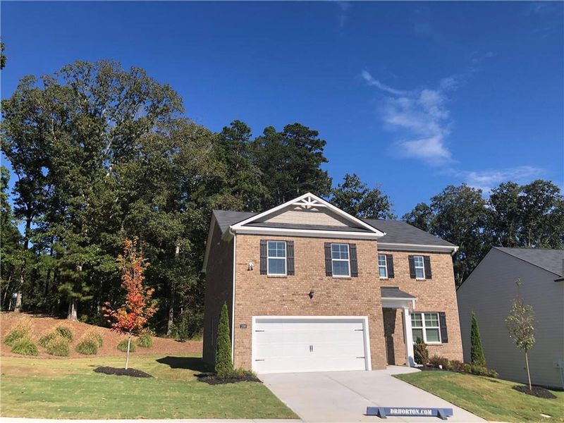 Front exterior of a new home in Brooks Village, Dacula, GA, highlighting curb appeal (Image 2).