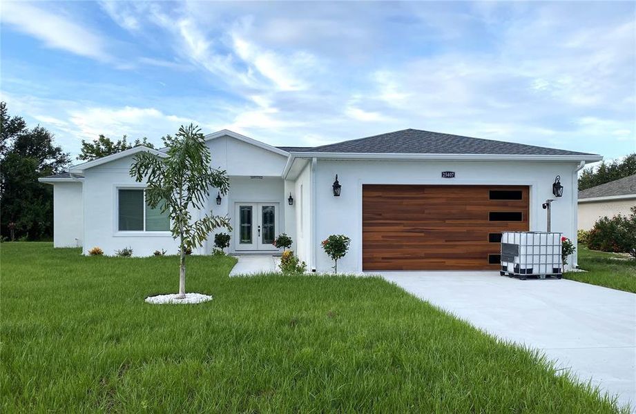 Front exterior of a new home in , Punta Gorda, FL, highlighting curb appeal (Image 2).