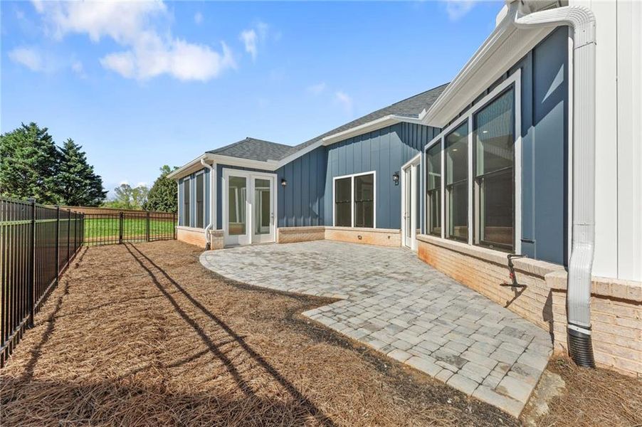 Exterior details and patio area of a home in The Courtyards of Franklin Goldmine, Cumming (Image 12).