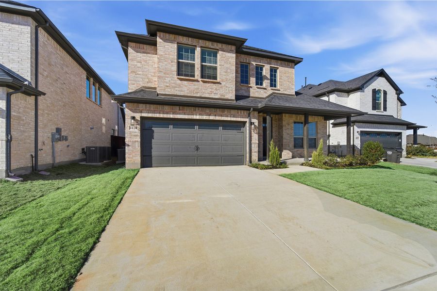 Front exterior of a new home in La Terra, Celina, TX, highlighting curb appeal (Image 25). Front exterior of a new home in La Terra, Celina, TX, highlighting curb appeal (Image 25).