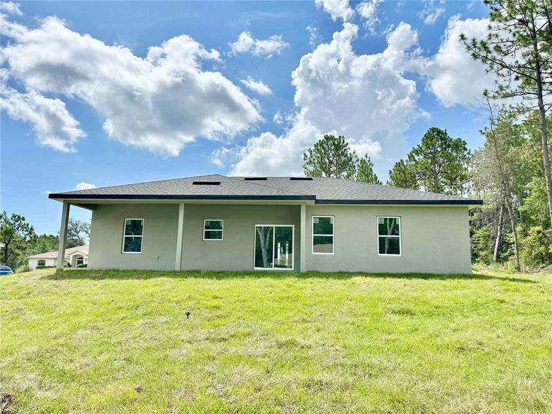 Front exterior of a new home in , Citrus Springs, FL, highlighting curb appeal (Image 18).