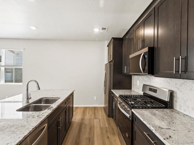 Furnished interior view inside a new home in Skyview at High Point, Aurora (Image 14).