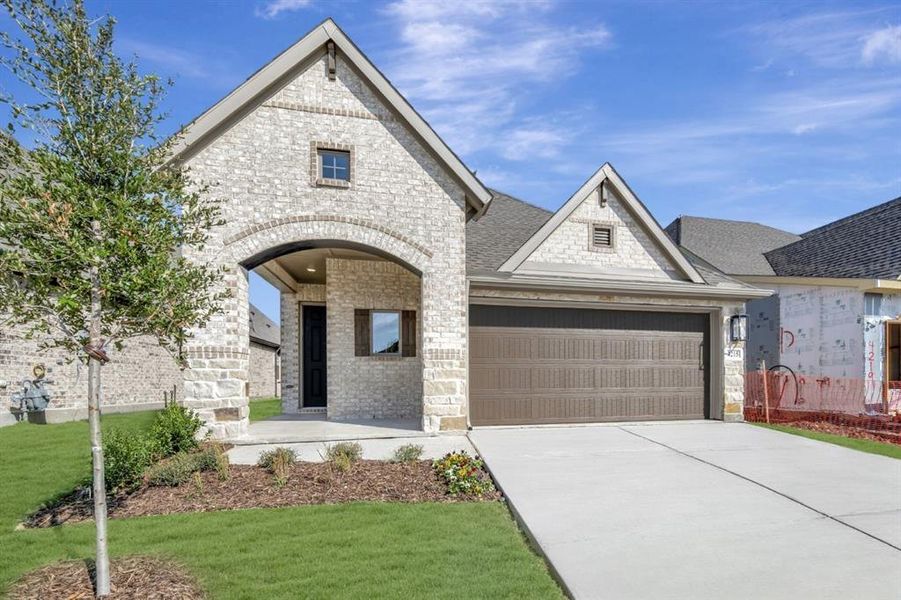 Front exterior of a new home in Creekshaw – Gardens, Royse City, TX, highlighting curb appeal (Image 1). Front exterior of a new home in Creekshaw – Gardens, Royse City, TX, highlighting curb appeal (Image 1).