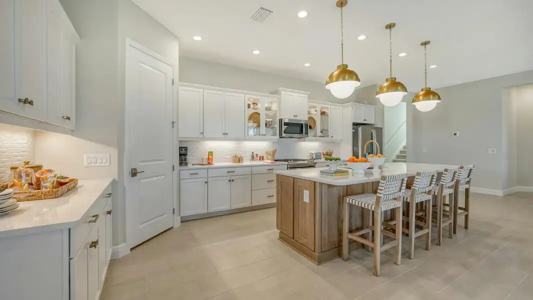 Furnished interior view inside a new home in Kingston South Real Estate and Homes for Sale in Estero, FL - Neal Communities, Estero (Image 12).