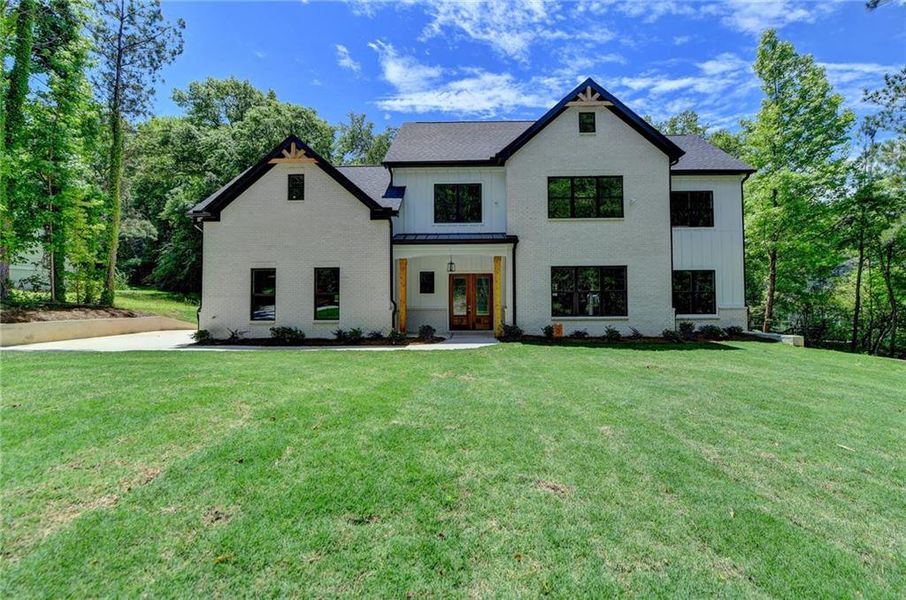 Front exterior of a new home in , Snellville, GA, highlighting curb appeal (Image 1). Front exterior of a new home in , Snellville, GA, highlighting curb appeal (Image 1).