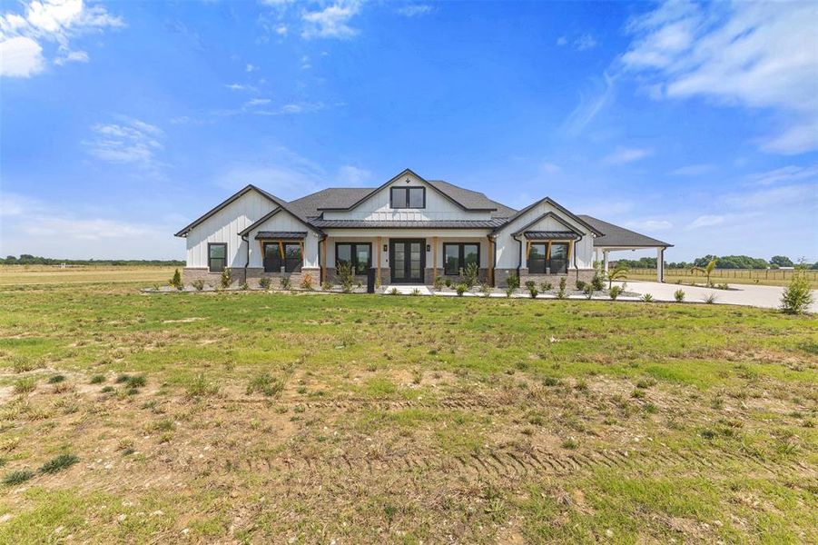 Front exterior of a new home in , Ennis, TX, highlighting curb appeal (Image 26).