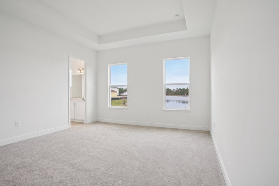 Representative unfurnished interior of a home built from the Siesta II by Ashton Woods in Ardisia Park, New Smyrna Beach (Image 9).