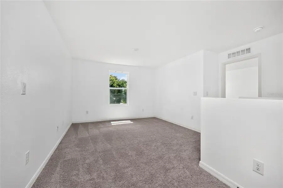 Spacious, unfurnished interior of a new home in , Port Charlotte (Image 48).