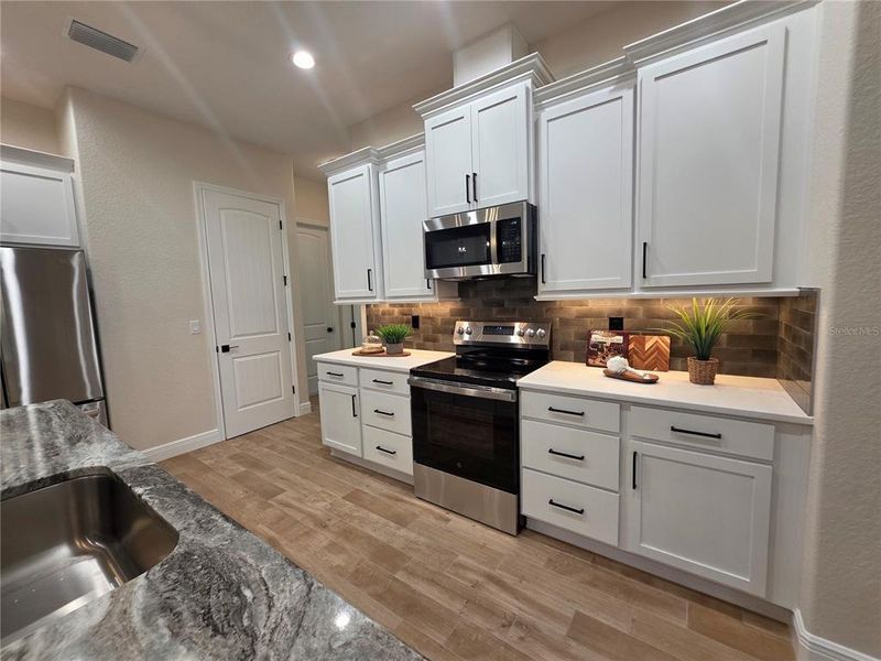 Furnished interior view inside a new home in , Brooksville (Image 13).