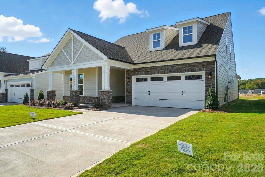 Front exterior of a new home in Heritage - 55+ Community, Indian Trail, NC, highlighting curb appeal (Image 2).