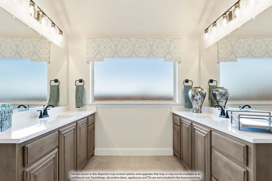 Master bathroom with dual vanities, wood cabinets, white countertops, and a frosted privacy window between the sinks. Master bathroom with dual vanities, wood cabinets, white countertops, and a frosted privacy window between the sinks.