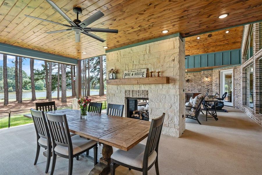 1,000sf of back patio space with dining area, living area and kitchen area.  Pine ceilings and big fans to keep it nice in the summer.  See through ventless fireplace.  Million dollar lake views while you enjoy a meal.