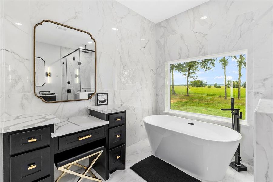 A makeup vanity in addition to the dual sink vanity....you might forget what you're doing with that view to the lake!