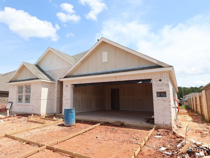 Front exterior of a new home in Magnolia Ridge, Magnolia, TX, highlighting curb appeal (Image 15).