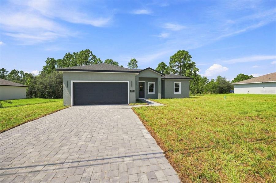 Front exterior of a new home in , Ocala, FL, highlighting curb appeal (Image 19). Front exterior of a new home in , Ocala, FL, highlighting curb appeal (Image 19).