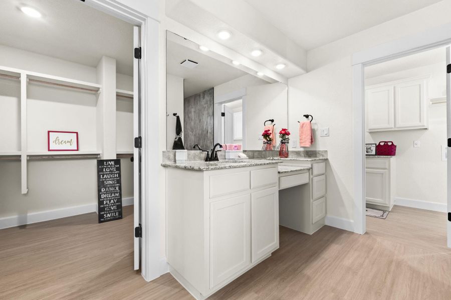 Full bathroom featuring vanity, light wood-style flooring, and recessed lighting